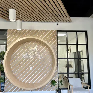 a large wooden plate in the middle of a room