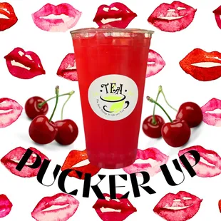 a cup of cherry juice surrounded by red lips