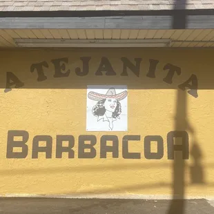 a sign on the side of a building