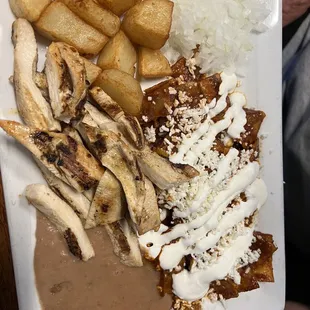 Chilaquiles plate with chicken fajita