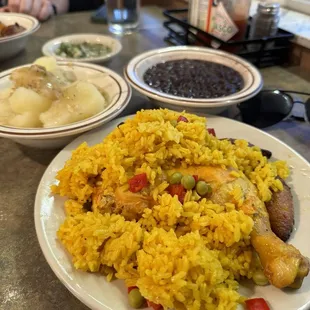 Chicken, rice, black beans, yuca and plantains.