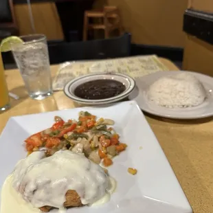 Stuffed fish, side of black beans and rice
