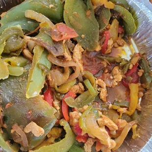 Chicken fajitas with tiny bits of chicken and oversized slices of peppers.