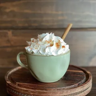 a cup of coffee with whipped cream