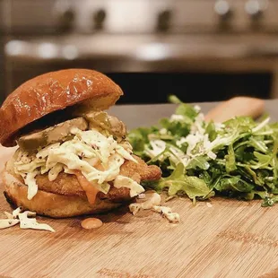 a chicken sandwich and a salad