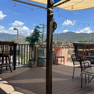 a patio with tables and chairs