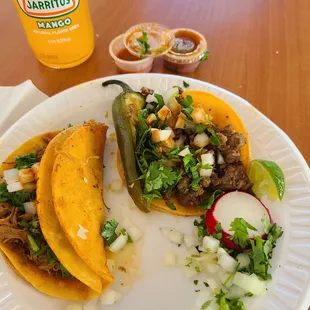 1 De Birria, 1 Asada taco, served with a  Serrano pepper and Roja sauce...my go to place for fresh Mexican