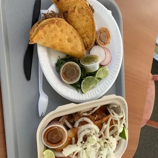 a plate of tacos, a salad, and a tortilla