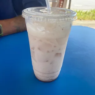 a close up of a drink in a plastic cup