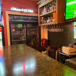 a bar with a television in the background