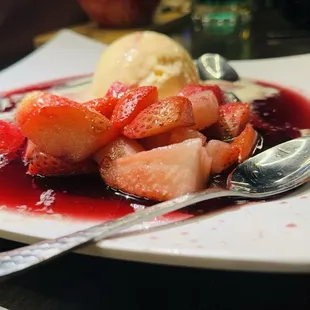 a plate of fruit and ice cream