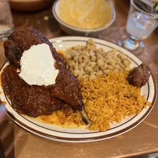 Pollo adobo chicken with rice and pesole