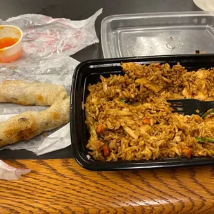 a plate of rice and a roll