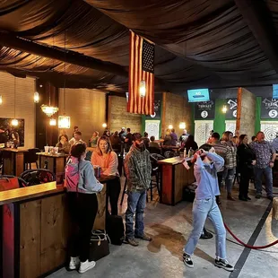 a crowd of people in a bar