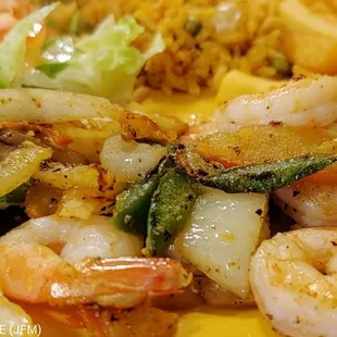 a plate of shrimp and fries
