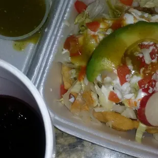 Homemade sope de asada, green salsa and Jamaica.