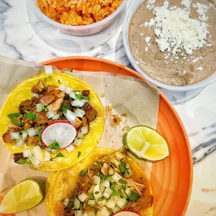 Al Pastor and Chile Verde with Rice &amp; Beans.