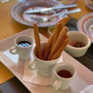 Churros with caramel and chocolate sauce