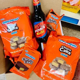 a box of snacks and a bottle of soda