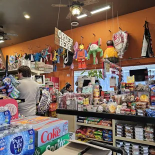 Cash wrap area and a wall of piñata.