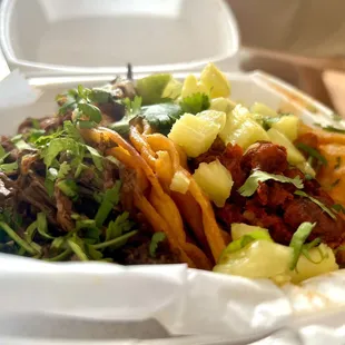 Beef birria taco and Hal pastor chicken taco