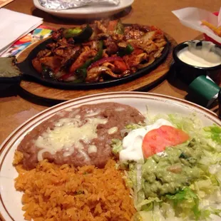 Fajitas of chicken,beef n shrimp with rice n beans