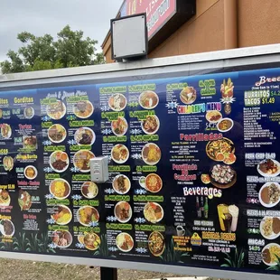 a menu board outside a restaurant