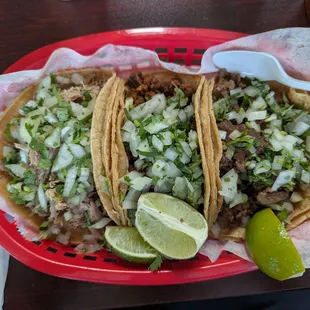 From left to right: Carnitas, Pastor, and Steak Tacos