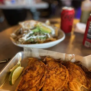 Birria tacos and Asada Chilaquiles in salsa verde.