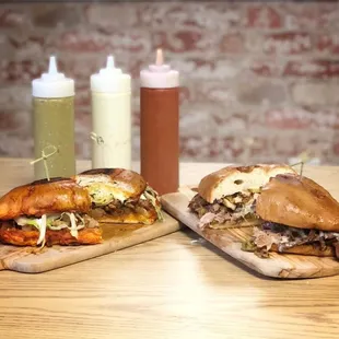 two sandwiches on a cutting board