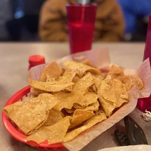 a plate of chips and a drink