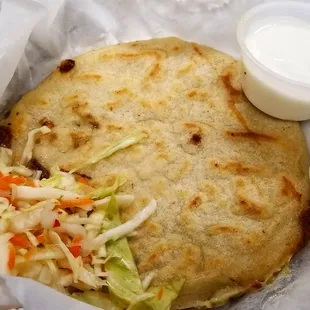 Pupusa de loroco con queso. (If you are unfamiliar with loroco, it is a vine with edible flowers. The flowers are similar to broccoli.)