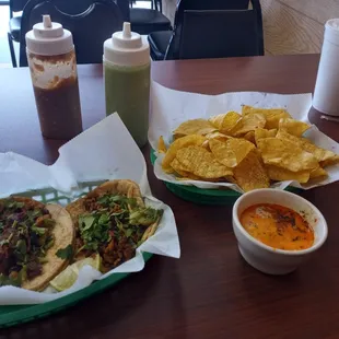 1 Chorizo taco and 1 alpastor taco and chorizo dip and chips