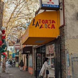 a woman walking down the sidewalk