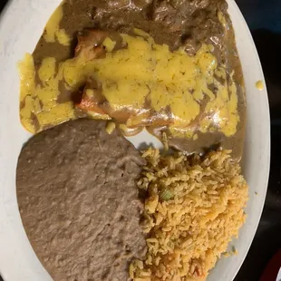 Cheese enchiladas, with carne guisada.