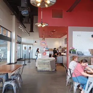people sitting at tables and eating