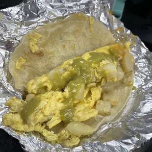 Potatoes egg and cheese with green salsa! Soo good!