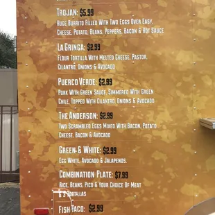 a menu on the side of a food truck