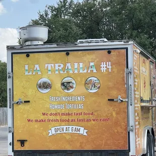 side / peripheral view of the food truck - states they open at 6am. ¡y homemade tortillas!