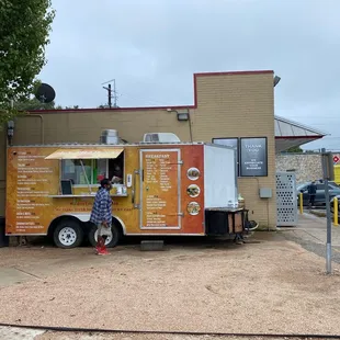 Taco truck next to Chevron