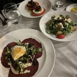 Beef carpaccio special, tomatoes and mozzarella and appetizer salad