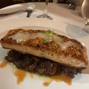 Sea bass with squid ink risotto and salmon over quinoa and veggies!