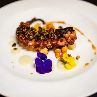 Grilled octopus over roasted chick peas lemon salsa