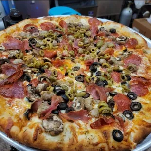The Italian meats pizza with mushrooms green and black olives added. My FAVORITE