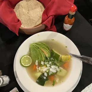 Caldo de gallina (chicken soup) veggie option with avocado wedge. Hits the spot on a cold day.