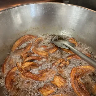 a frying pan filled with bacon