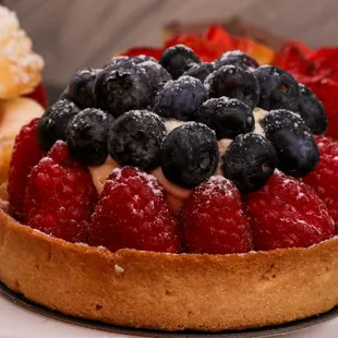 two pastries with berries on top