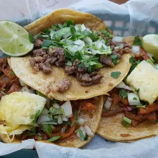 Steak taco (middle) Pastor tacos (sides)