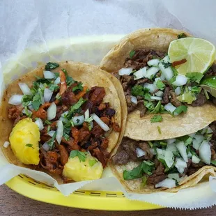 two tacos on a yellow plate
