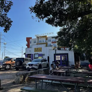 Outdoor area of parking lot and bar.